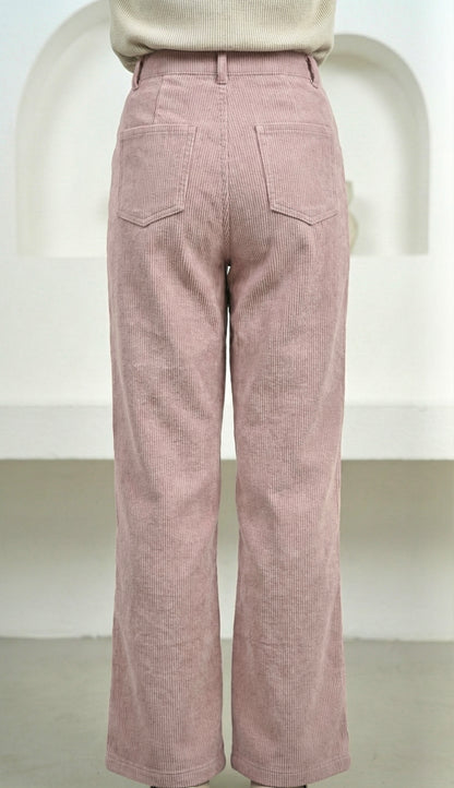 Pink corduroy pants on a white background