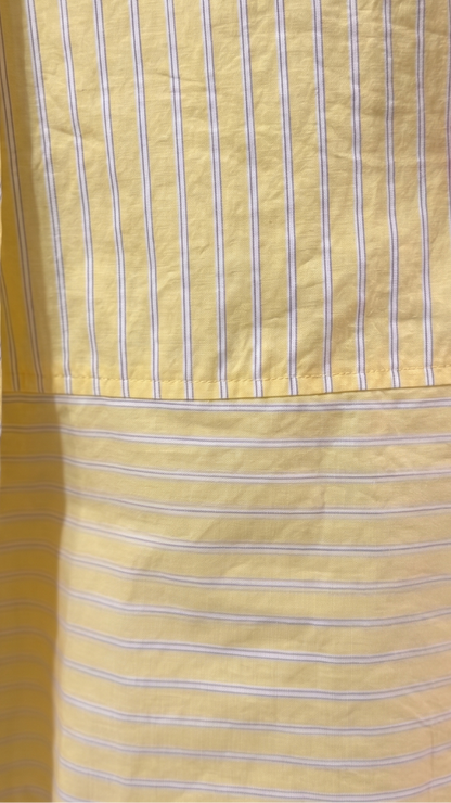 Close-up of a yellow apron with white stripes