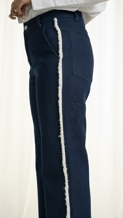Navy pants with white trim on a plain background