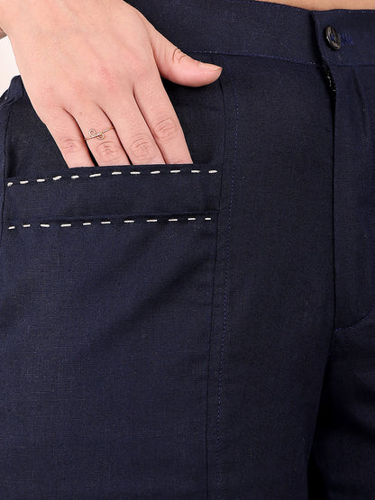 Navy blue pants with a hand touching the pocket