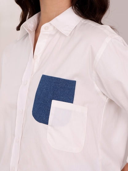 White shirt with a blue square patch on a plain background